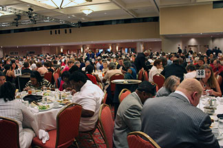 The Marriott staff fitted as many diners into the Renaissance Ballroom for the banquet as they could. Even so, some three hundred were seated at tables in the large foyer.