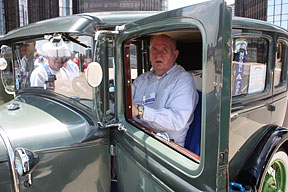 Harold Wenning sits in the driver&rsquo;s seat of a 1929 Ford at the classic auto and motorcycle show sponsored by the CARS Division.