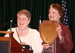 Ramona Walhof and Barbara Pierce holding her plaque