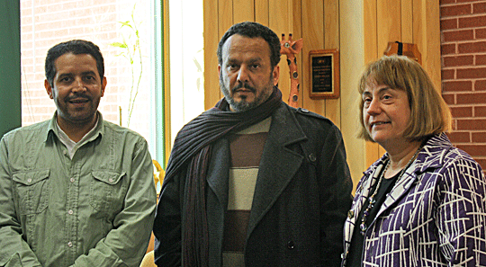 Ahmed M. Alammar (left) and Khaled Suleiman Abdullah (right) visit with Dr. Joanne Wilson, NFB executive director of affiliate action and former director of the Louisiana Center for the Blind.
