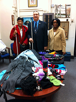 Pictured here with donations are Denice Brown, Greater Philadelphia Chapter president; James Antonacci, NFB of Pennsylvania president; and Betty Sago, Whittier Elementary School principal.