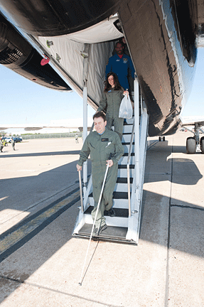 Mark Riccobono goes down the stairs as he exits the simulator.