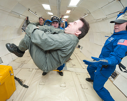 Mark Riccobono is shown doing a summersault, but since he is weightless, no part of his body is touching a solid surface.