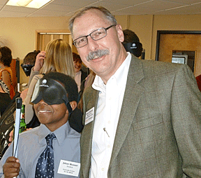 Littleton Mayor Pro Tem Bruce Stahlman with Colorado Center for the Blind student Jabari Bonner during the Chamber�s annual networking event at the center. Photo by Stacey Johnson, CCB