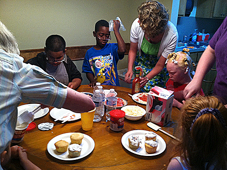 Louisiana BELL students frost cupcakes for a snack.