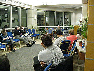 Donna Hill playing guitar for group of education majors.