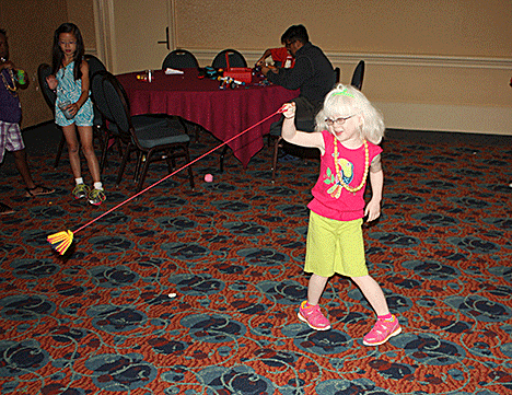 Chloe Darlington playing with a stretchy yo-yo