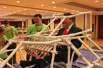 Mark Riccobono takes a spin in the spacecraft designed by the aerospace engineering class.
