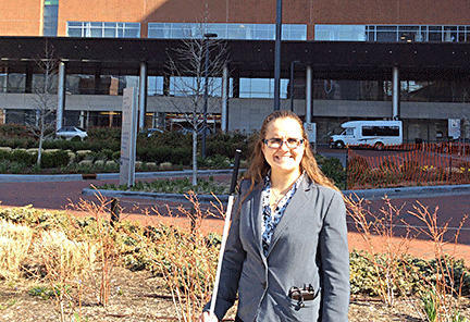 Rose Sloan standing in front of Johns Hopkins Hospital.