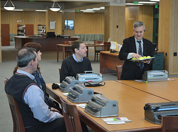 Steve Booth instructs participants in the positions of a Braille cell.