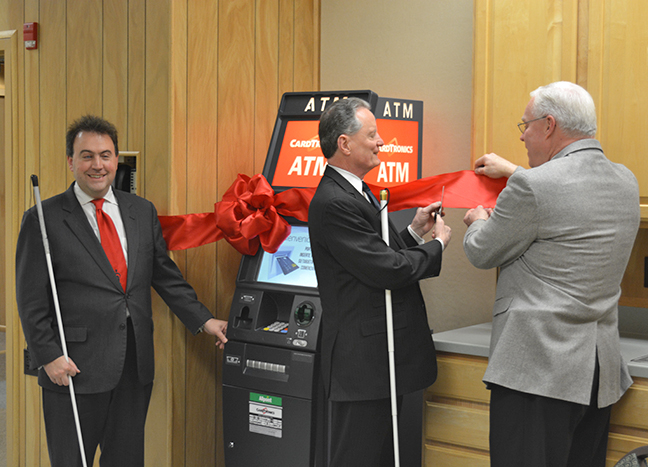 (Left to right) Mark Riccobono stands with Marc Maurer and Randy Rice of Cardtronics as Dr. Maurer prepares to cut the ribbon on the new Cardtronics accessible ATM.