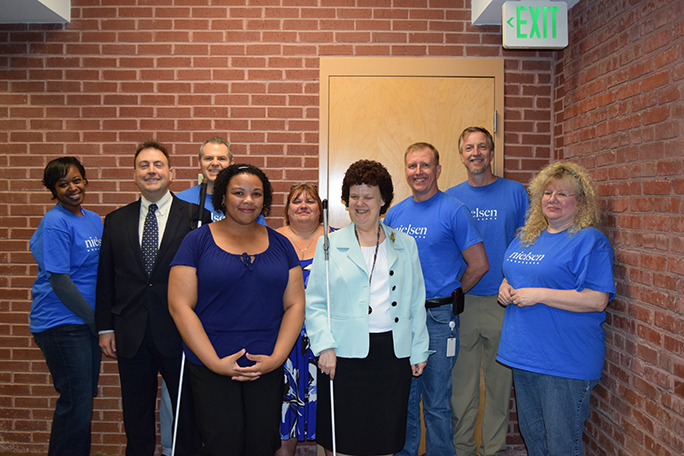 Part of the Nielsen Cares team poses with President Riccobono, Mya, Jen, and Mrs. Maurer