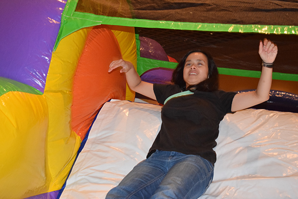 Federationist fearlessly drops onto the slide in the inflatable obstacle course.