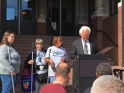 Cincinnati Vice Mayor David Mann reads Meet the Blind Month and White Cane Safety Day proclamations.