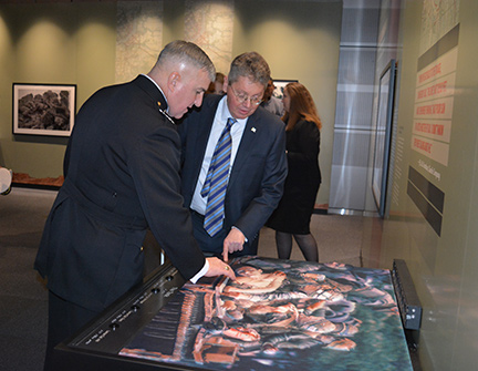 Gen. Glenn Walters and John Par&eacute; examine the 3D rendition of &ldquo;The Tank.&rdquo;
