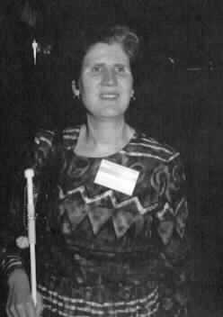 Image of Deborah Kent Stein with her white cane.