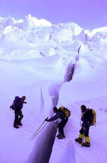Erik Weihenmayer prepares to jump a deep crevasse.