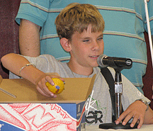 At the mock press conference, Alex Butler (KS) describes his project for the alternative energy sources session.