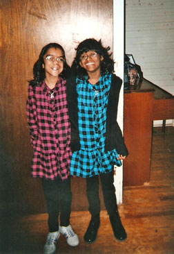 Smiling portrait of Marie and Michelle, taken in the family living room.