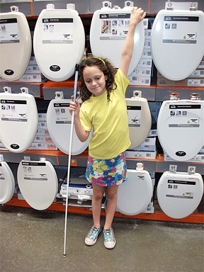 Kendra enjoys the toilet seat display.