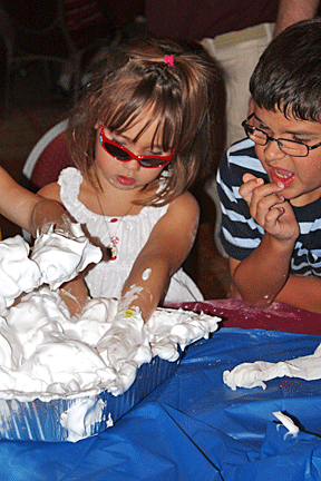 Kids hunt for surprises in mounds of foam.