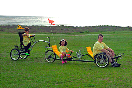 Richard Holloway with children Kendra and TJ pose with their recumbent trike 