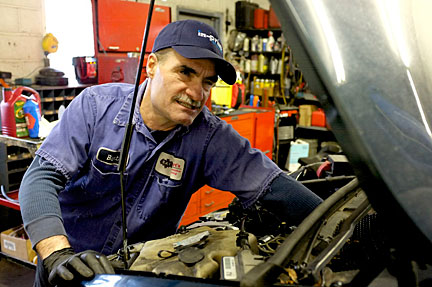 Bart Hickey working on an engine