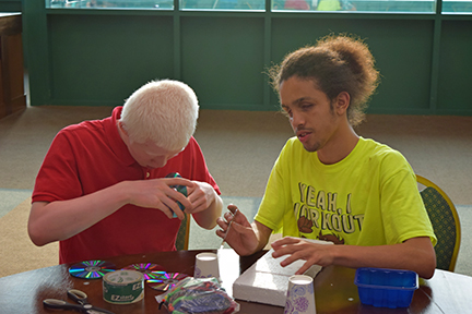 Angel Ayala (right) works on a STEM2U project with Elijah Anderson of Virginia.