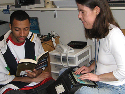 Serena Cucco takes notes while working with a reader.