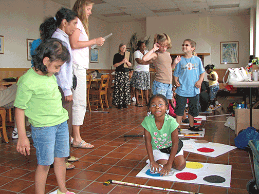 Children have fun playing Braille Twister.