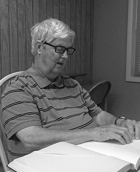 Robert Gardner reading Braille.