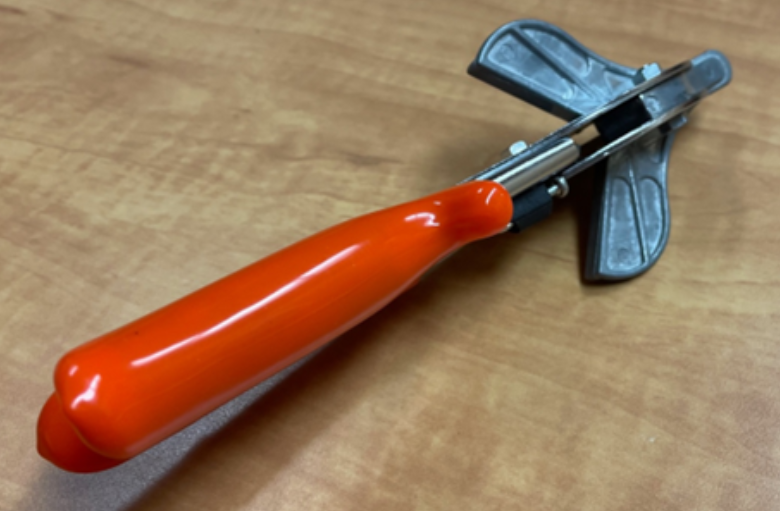 A pair of angle cutting shears which look like sheers with a wing on each side of the blade.