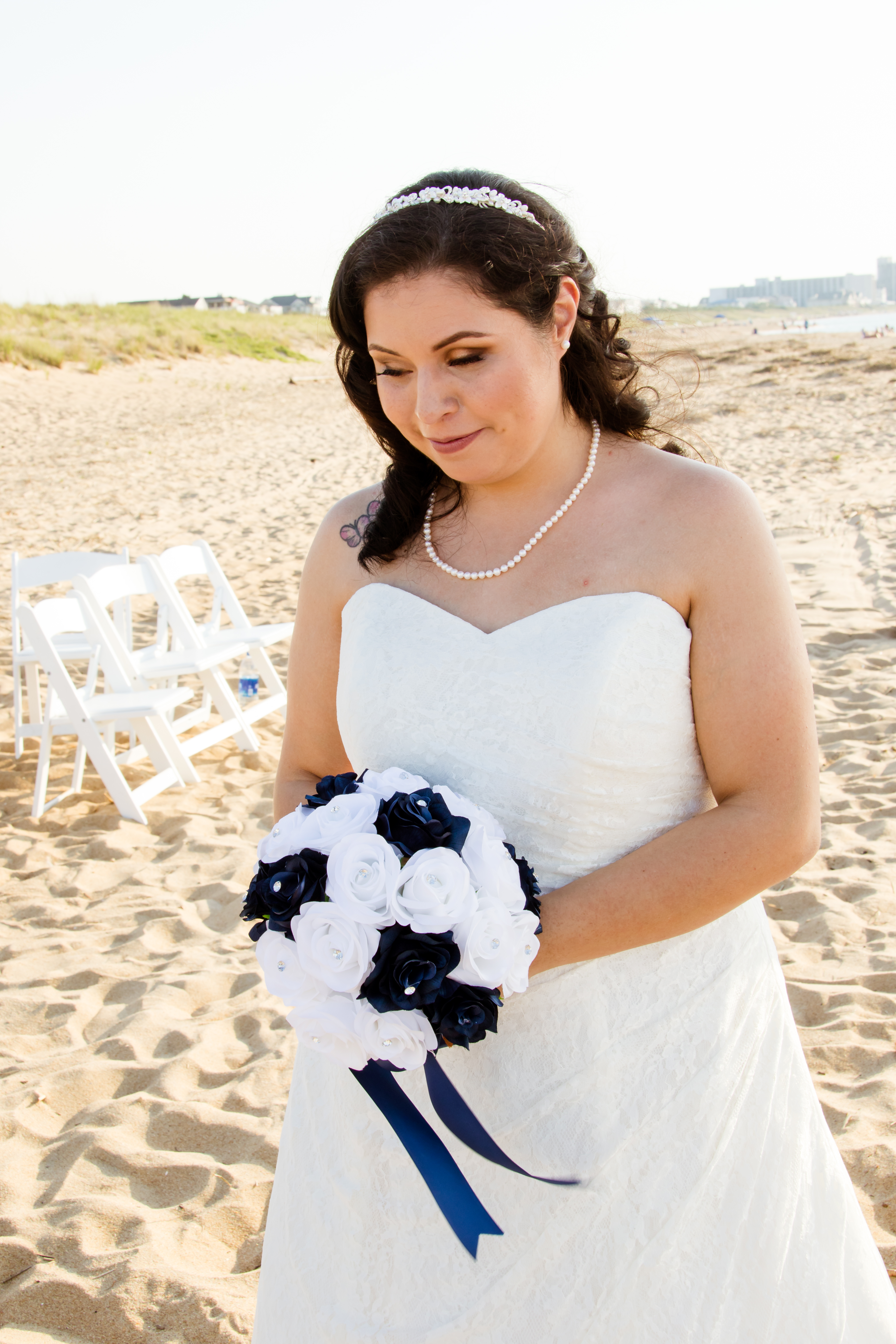 Danielle McCann in her wedding dress holding flowers