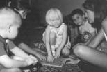 Picture of children working on a puzzle.