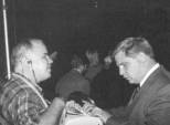 Photo of Jaime Fradera and Doug Trimbel sitting at a Tel-a-touch machine.