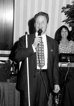 President Maurer sings at Karaoke Night.