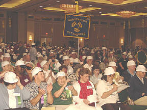 Everyone in the audience donned hard hats as soon as they were passed out.
