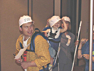 Noel Nightingale, her husband Jim Peterson, and their baby daughter Leila all wearing hard hats.