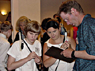 Amanda Jones (TN) and Renee Neddo (MI) sign up for the scavenger hunt with Brad Weatherd (MT)