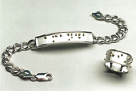 Braille bracelet and ring, custom made by Designs in Braille