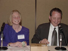 Shawn Mayo and President Maurer make a bet during the student division meeting.