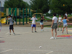 Five students get a workout using Hula Hoops