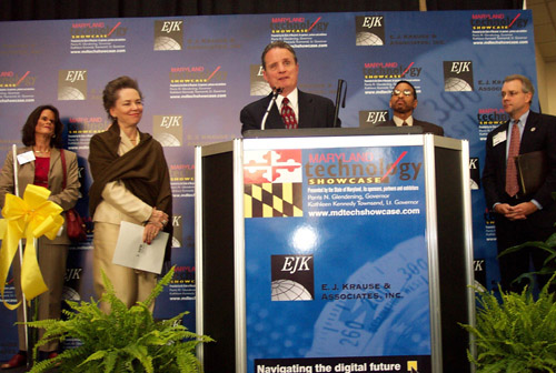 President Maurer presented Secretary Richkus with a plaque during the opening ceremonies.   Pictured here left to right are Dr. Betsy Zabrowski, NFB director of special programs; Peta N. Richkus, secretary of the Maryland Department of General Services; NFB President Marc Maurer; Major Riddick, Jr.; and Ji m Herbert.