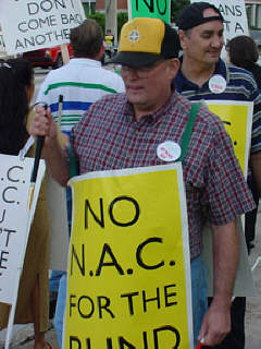 Every marcher wore a cheerful buttom saying "All I want for Christmas is no more NAC!"  Here two Federationists can be seen wearing their buttons.