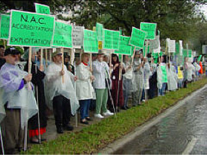 Picketers display their signs and serenade Tampa's morning rush-hour traffic.