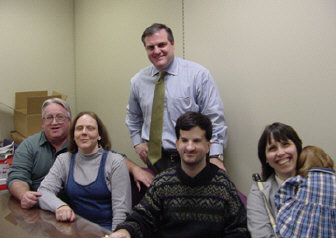 Donna Hartzell (left), first vice presidentf of the president of the NFB od Arkansas, and other affiliate members meet with Senator Mark Pryor (standing center).