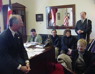 Congressman Bob Beauprez (R-CO) listens to Dianne McGeorge, president of the NFB of Colorado, and other affiliate members.