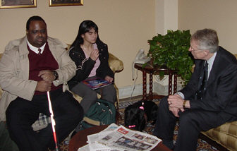 William Harmon,Jr.., president of the NFB of Nevada, and Raquel Silva discuss issues with Senator Harry Reid.