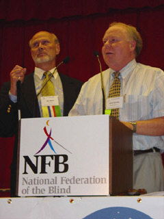 Doug Boone responds to the award presentation while Jim Omvig listens.