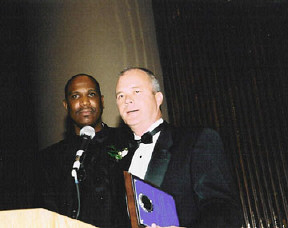 Pat Wingo, state assistant vice president for government affairs for AT&T, accepts a corporate partnership award for AT&T's support of NFB-NEWSLINE in Georgia.